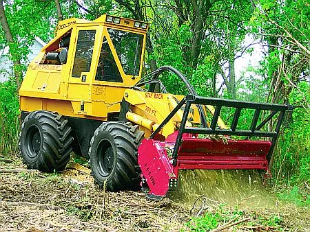 Forestry equipment working across a cleared tract of land